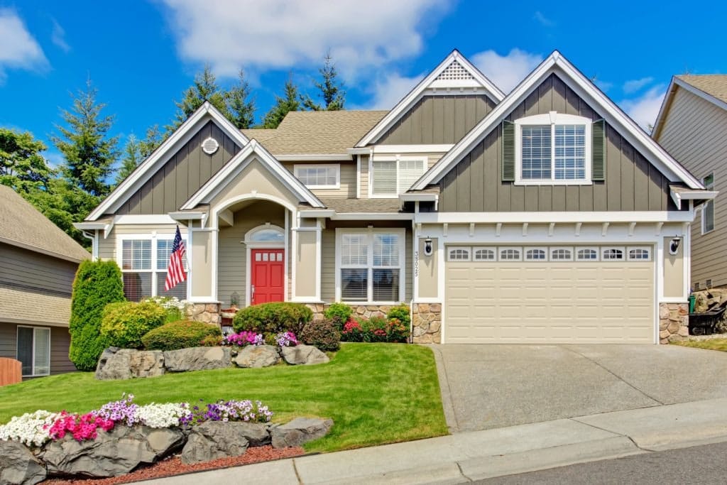 House in a neighborhood with a red entry door